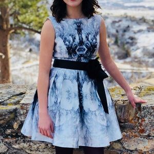 Beautiful mini dress. White background with black and grey flowers.